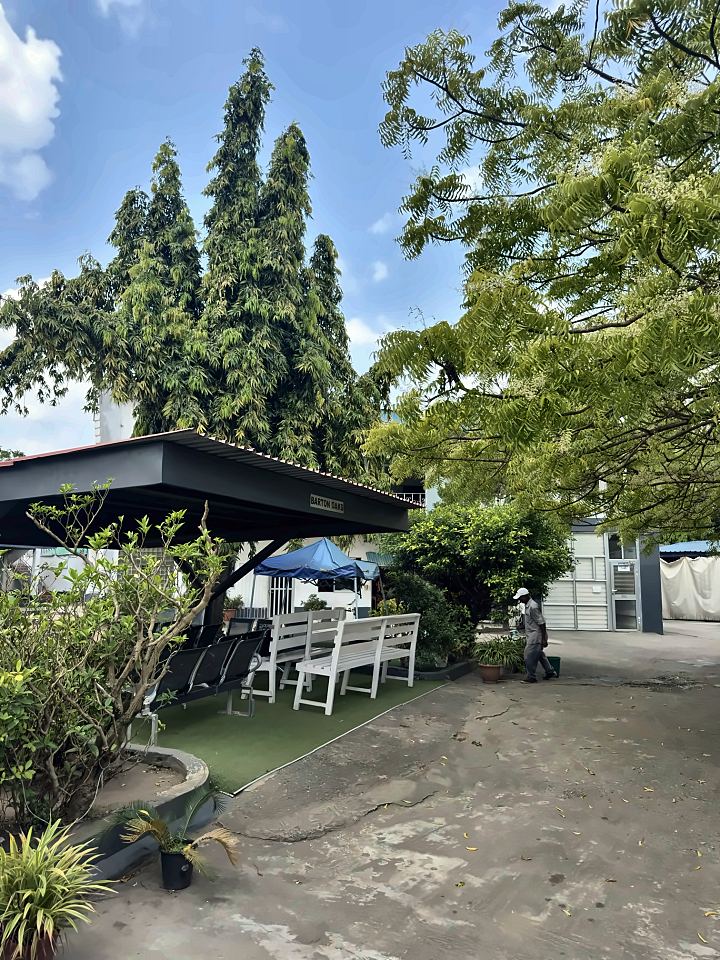 Barton Oaks, a shaded seating shelter under tall trees
