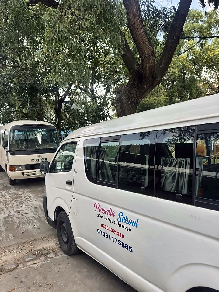 Priscilla School bus with the school name, address and phone numbers on the side